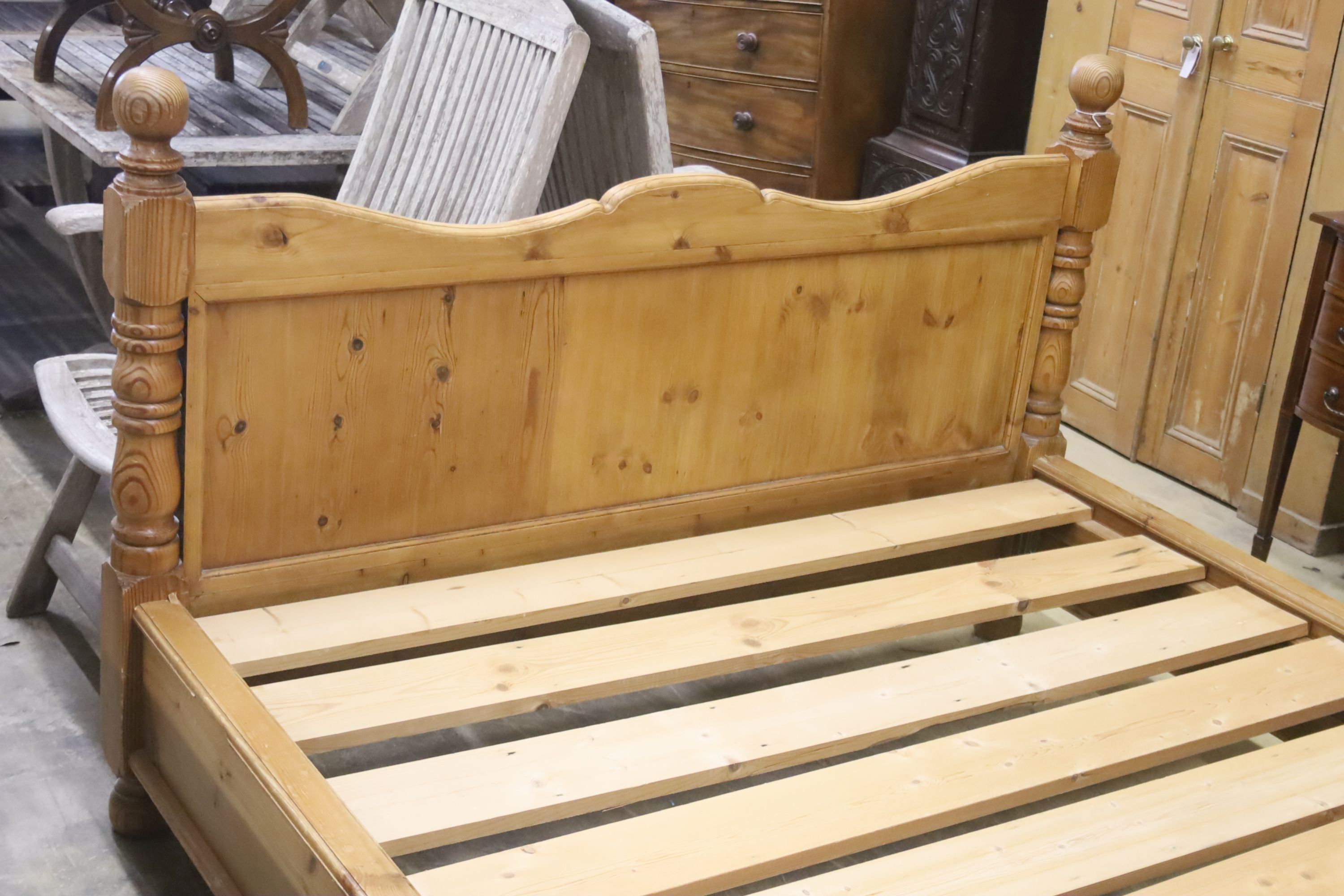 A king size pine bed frame with side rails and slats, width 170cm, length 213cm